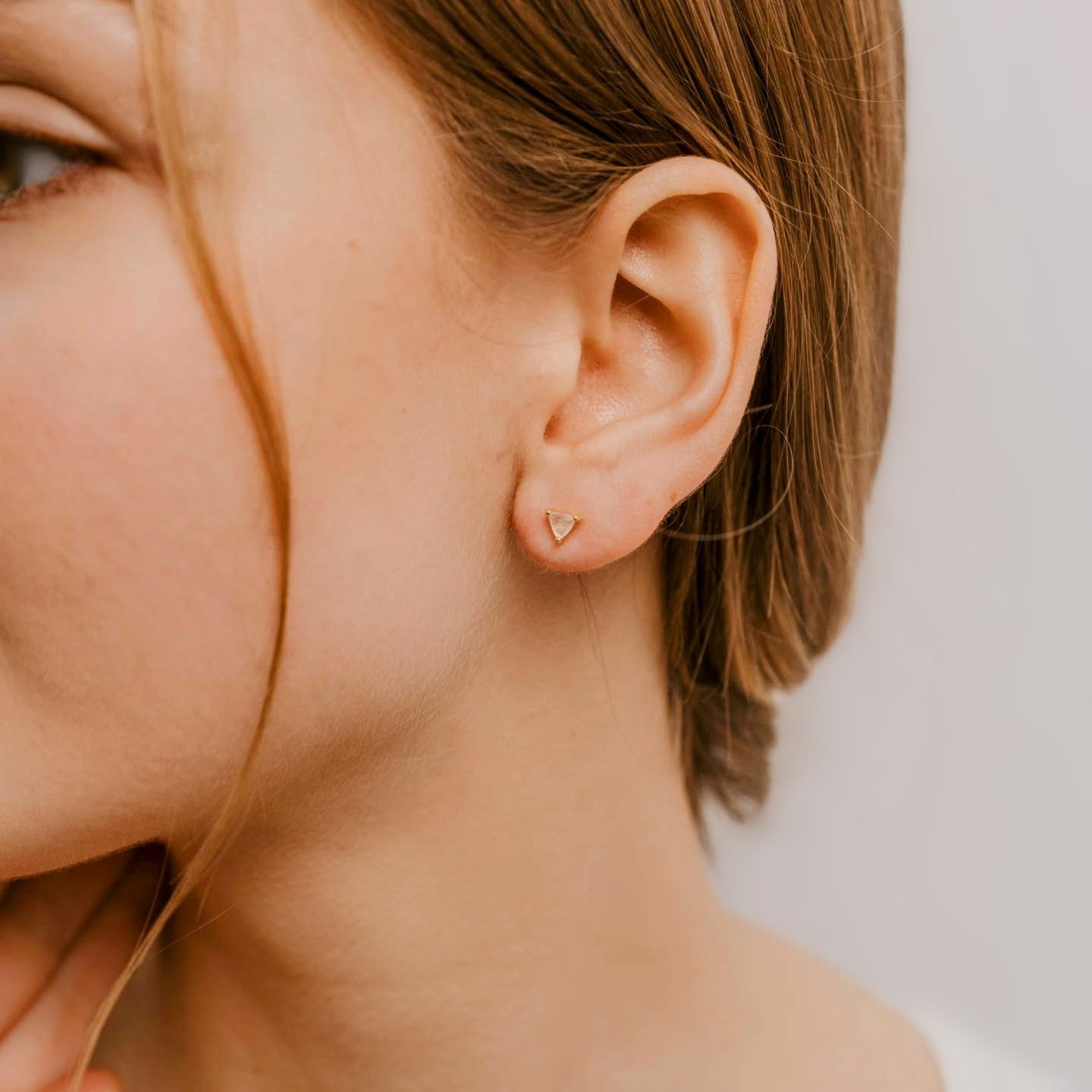 Triangle Gemstone Stud Earrings on Model