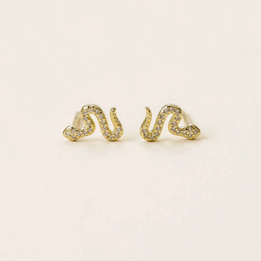 a pair of yellow gold snake earrings with simulated diamonds