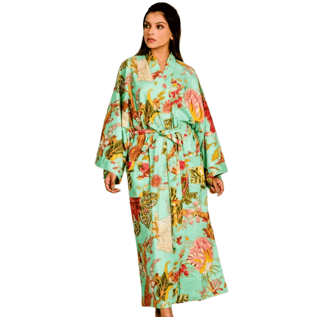 Woman wearing a light green floral kimono-style robe on a white background