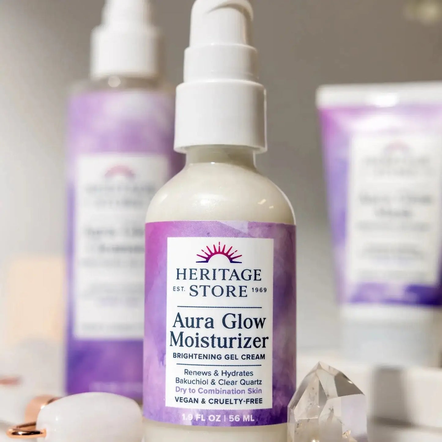 Heritage Store Aura Glow Moisturizer for Face with Bakuchiol and Clear Quartz, ideal for dry to combination skin, 1.9 fl oz bottle on display.