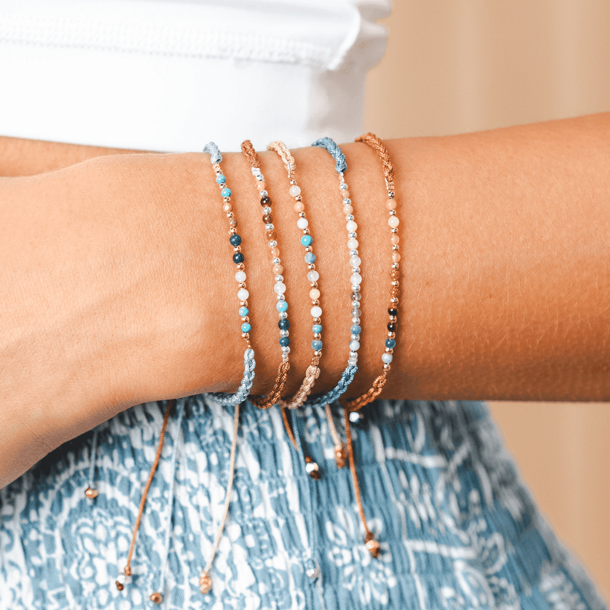 Master Healer Namaste Bracelet Next to Other Lotus and Luna Bracelets