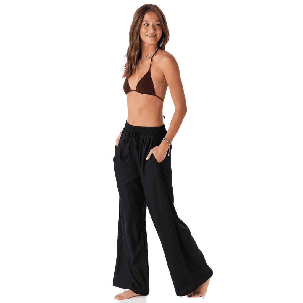 black wide leg pants with pockets and drawstring high-rise waist on model side view