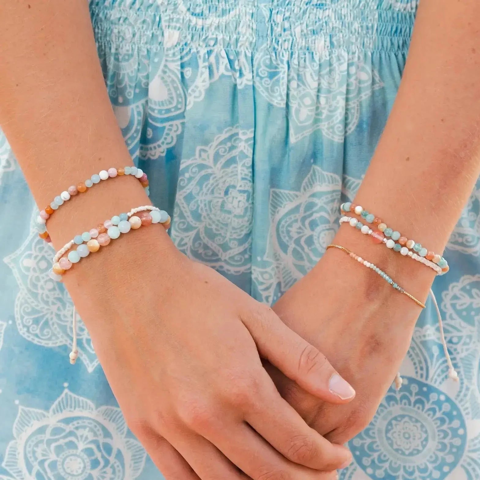Model wearing Lotus and Luna bracelets.