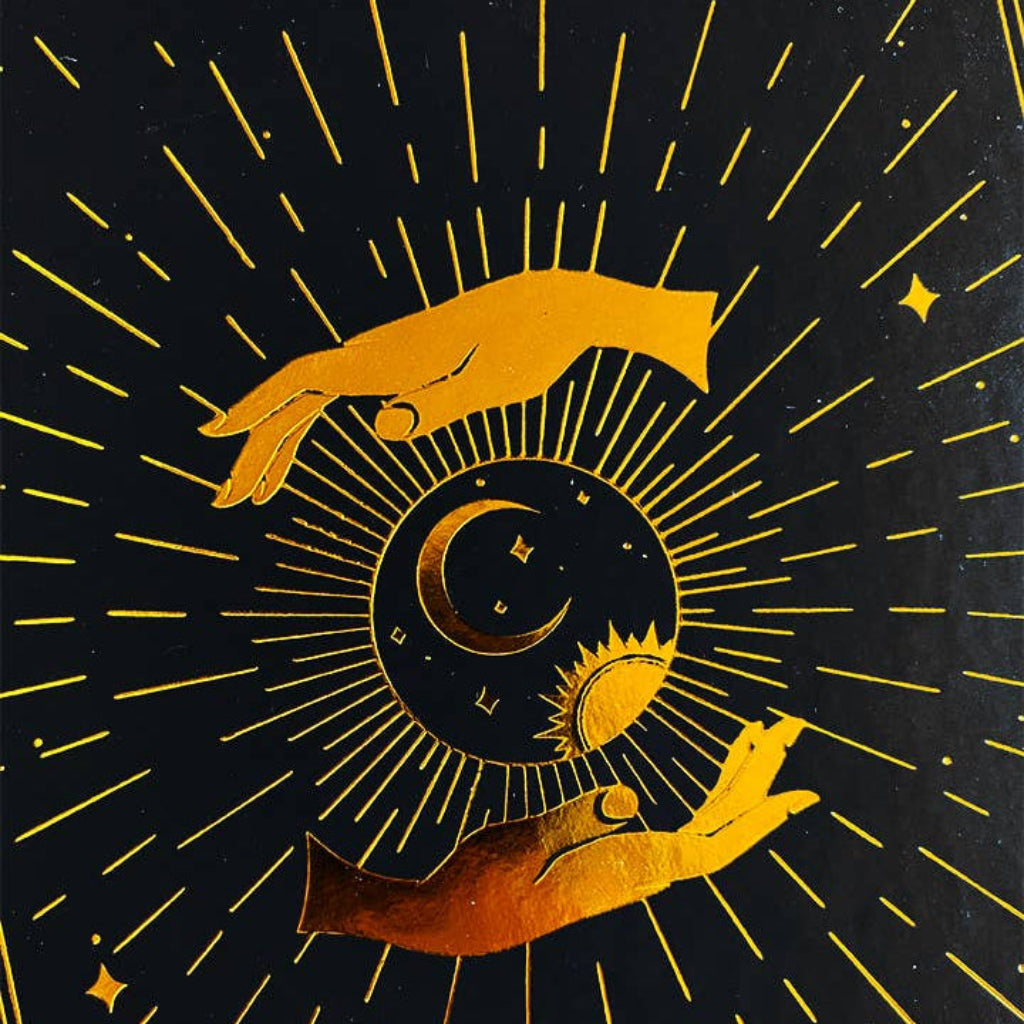 Decorative design with hands holding a sun and moon against a black background with gold accents.