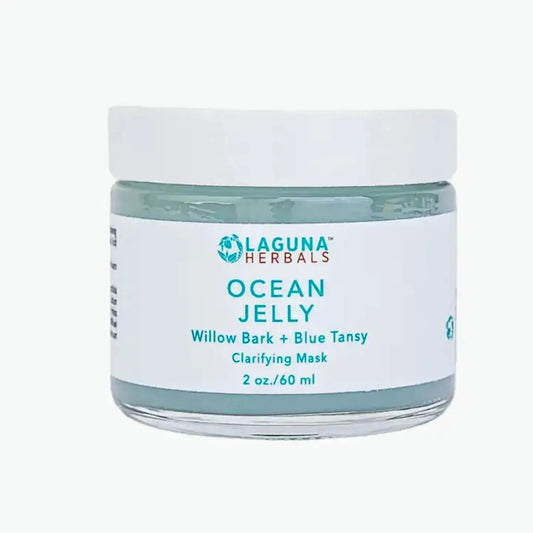a jar of ocean jelly face mask on a white background
