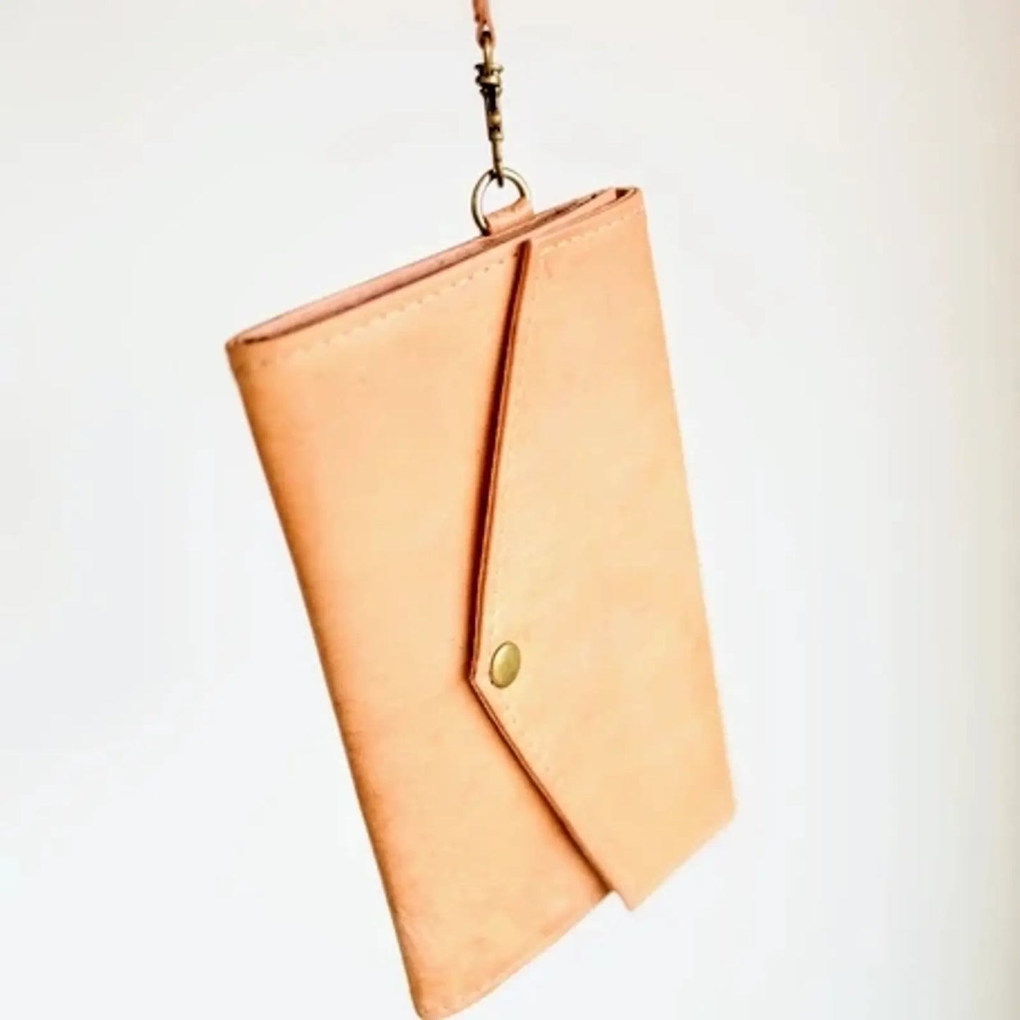 leather wristlet wallet with snap front closure in brown color