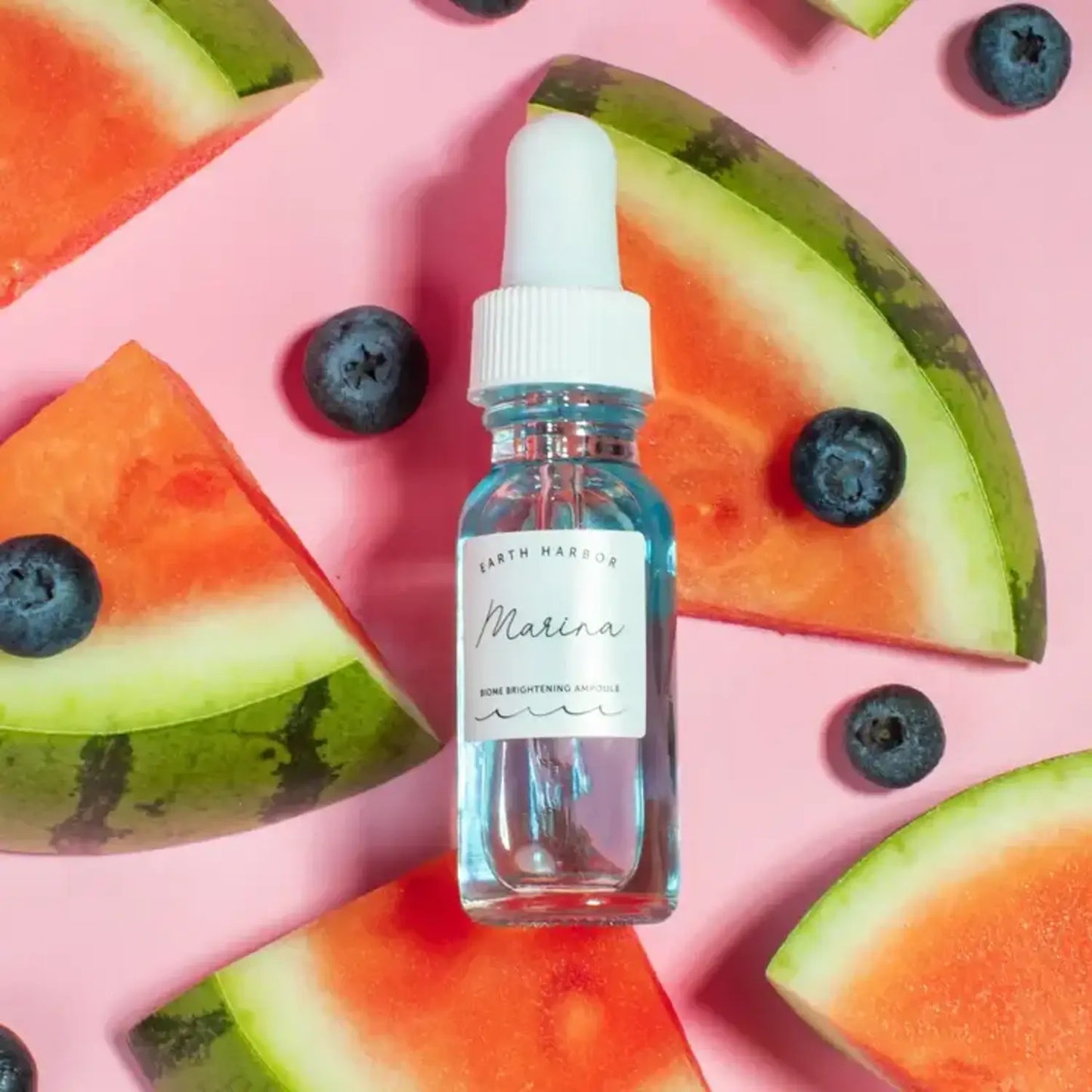 Bottle of Earth Harbor Marina Face Serum with Watermelon and Blueberries