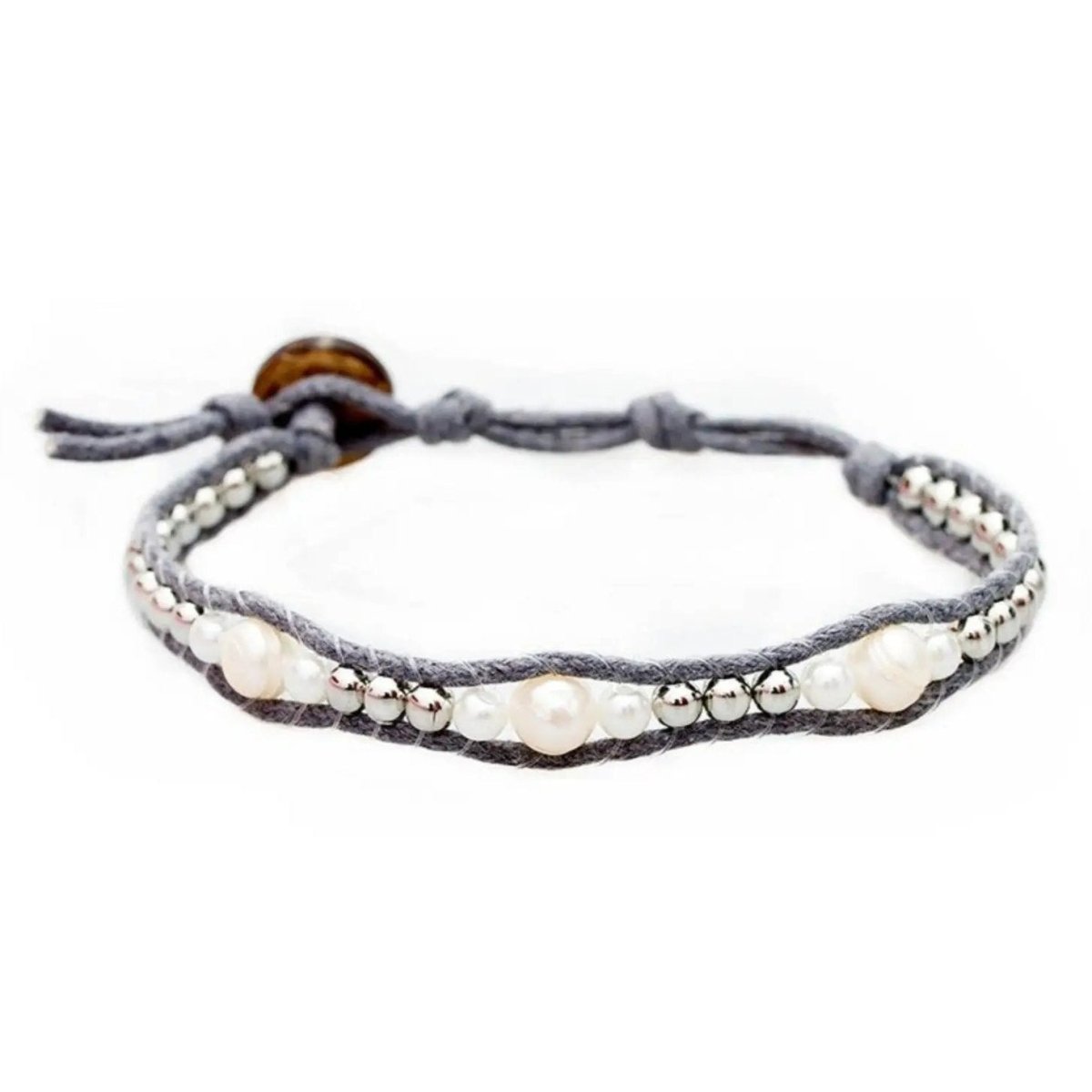 white pearl bracelet on a woven grey cotton cord, the snow angel bracelet by lotus and luna
