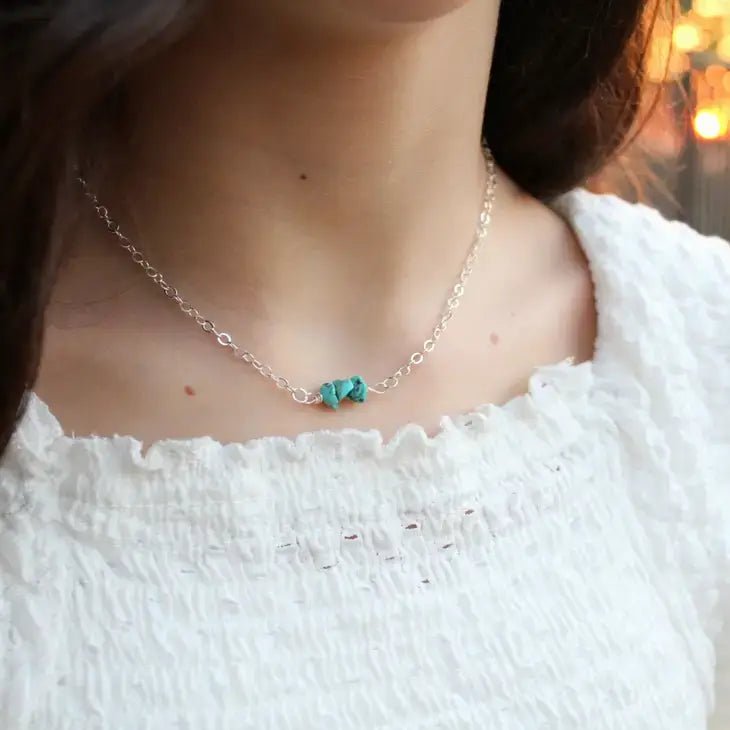 a close up of a woman wearing a turquoise necklace by Kelly Naturals 
