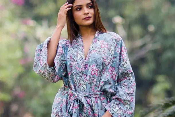 a woman in a grey floral print robe