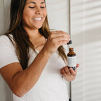 A woman demonstrating Skip the Shot Berberine Tincture Natural Weight Management Support