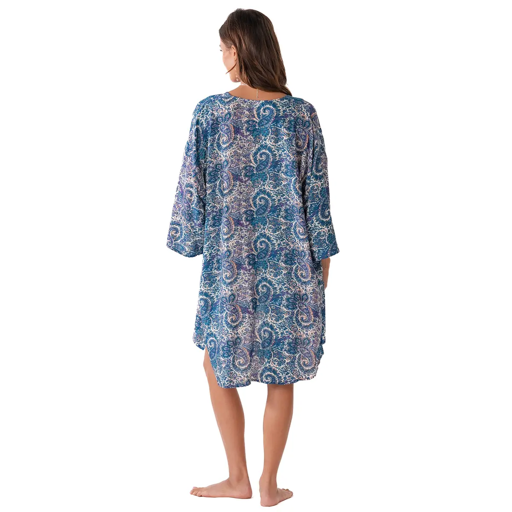 Lotus and Luna Beach Cover in blue paisley print, lightweight handmade swim wrap with side slits, shown from the back on a model.