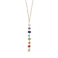 7 Chakras Necklace with raw gemstone beads on a yellow gold chain, aligned vertically to represent each chakra energy center.