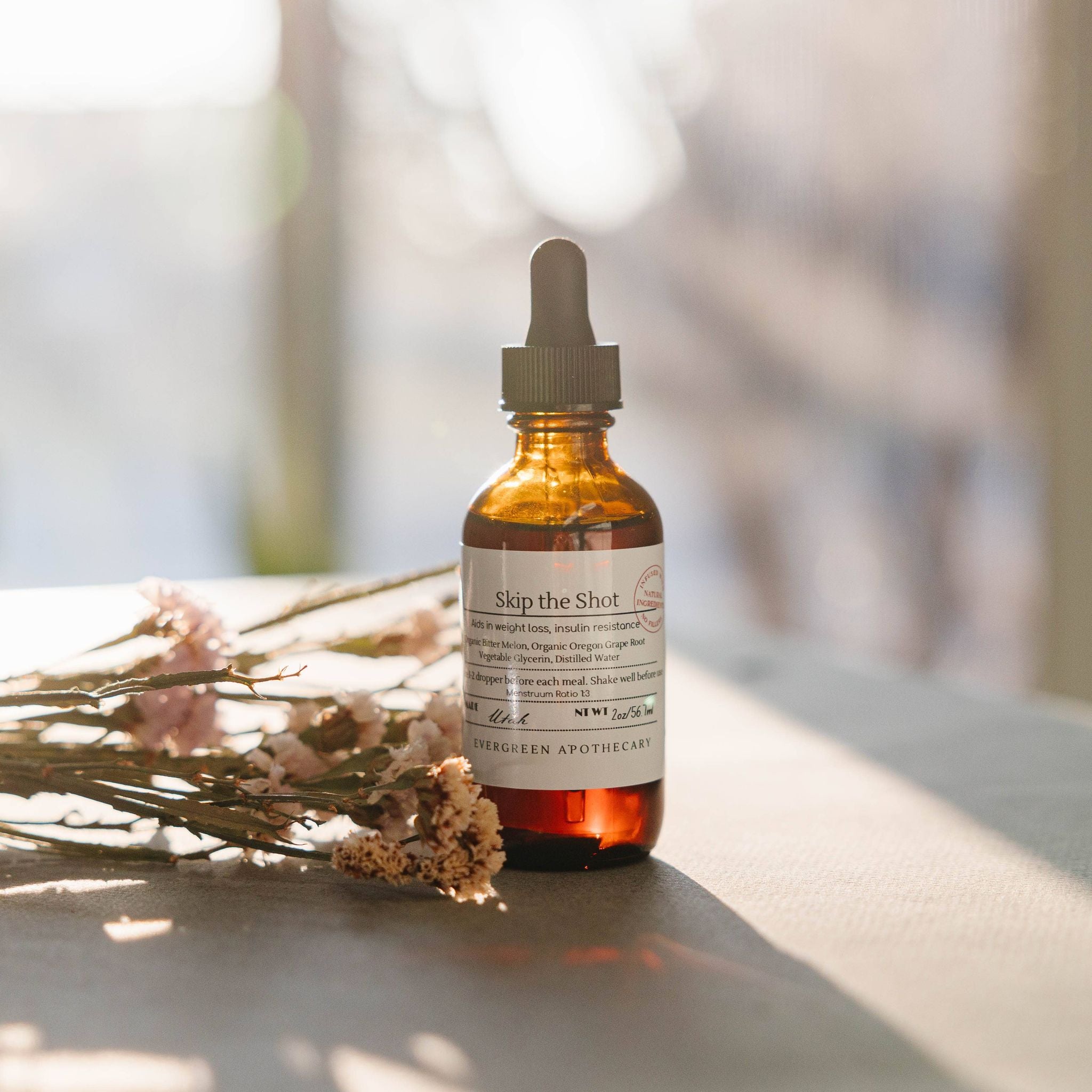 Skip the Shot Berberine Tincture for my Natural Weight Management Support next to dried herbs 