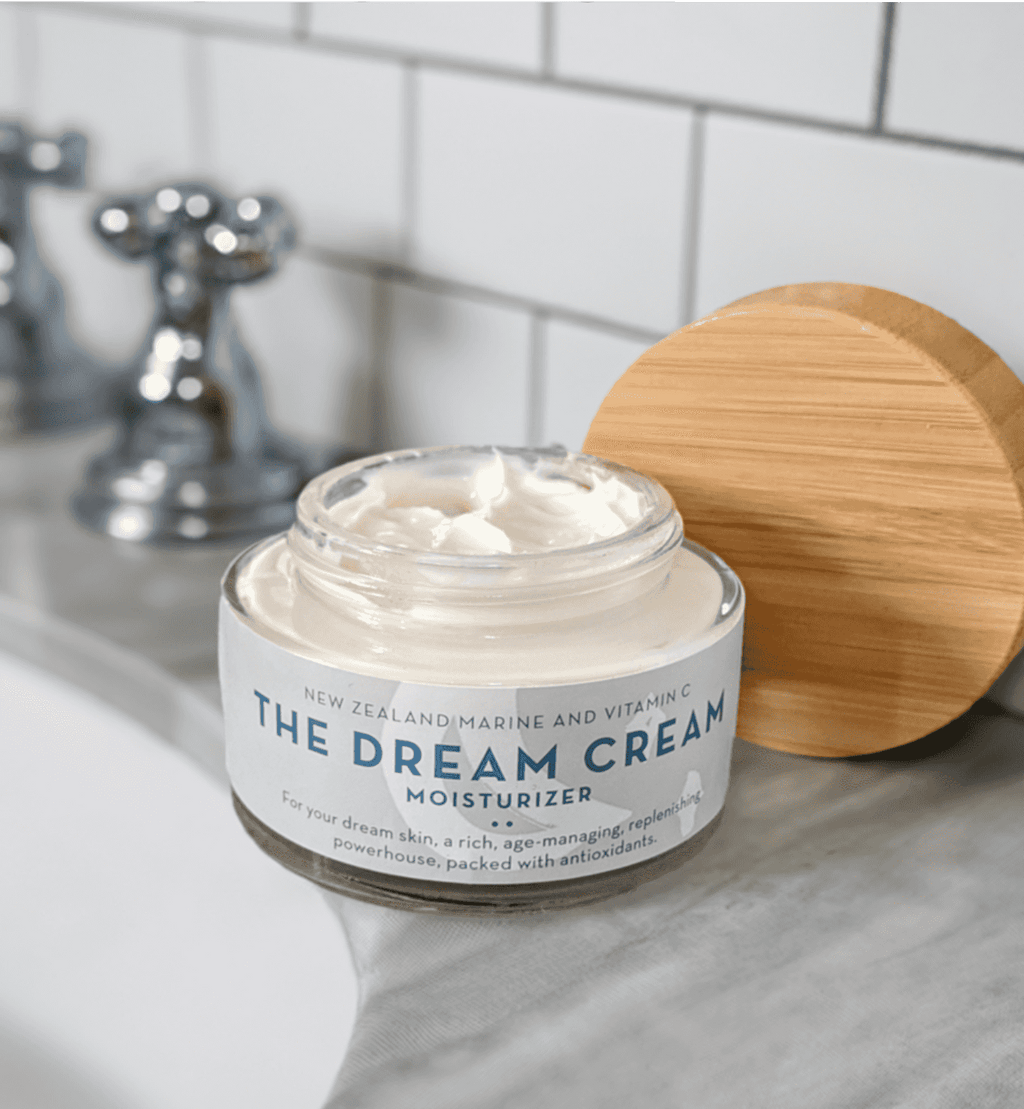 A Jar of The Organic Skin Co Dream Cream Facial Moisturizer on Bathroom Counter