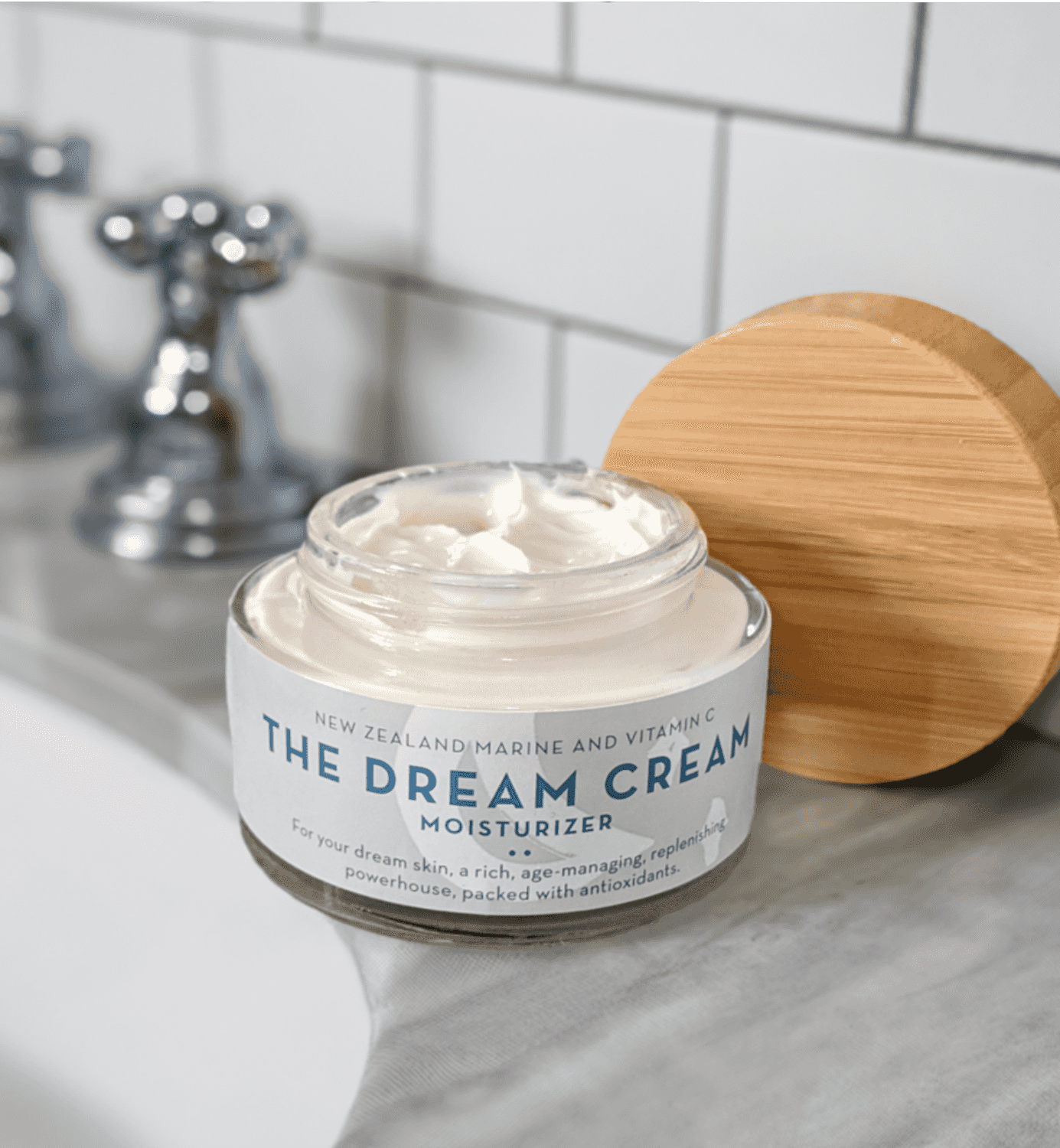 A Jar of The Organic Skin Co Dream Cream Facial Moisturizer on Bathroom Counter
