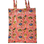 Pink floral women's pajama set by the Fox and the Mermaid with matching bag.