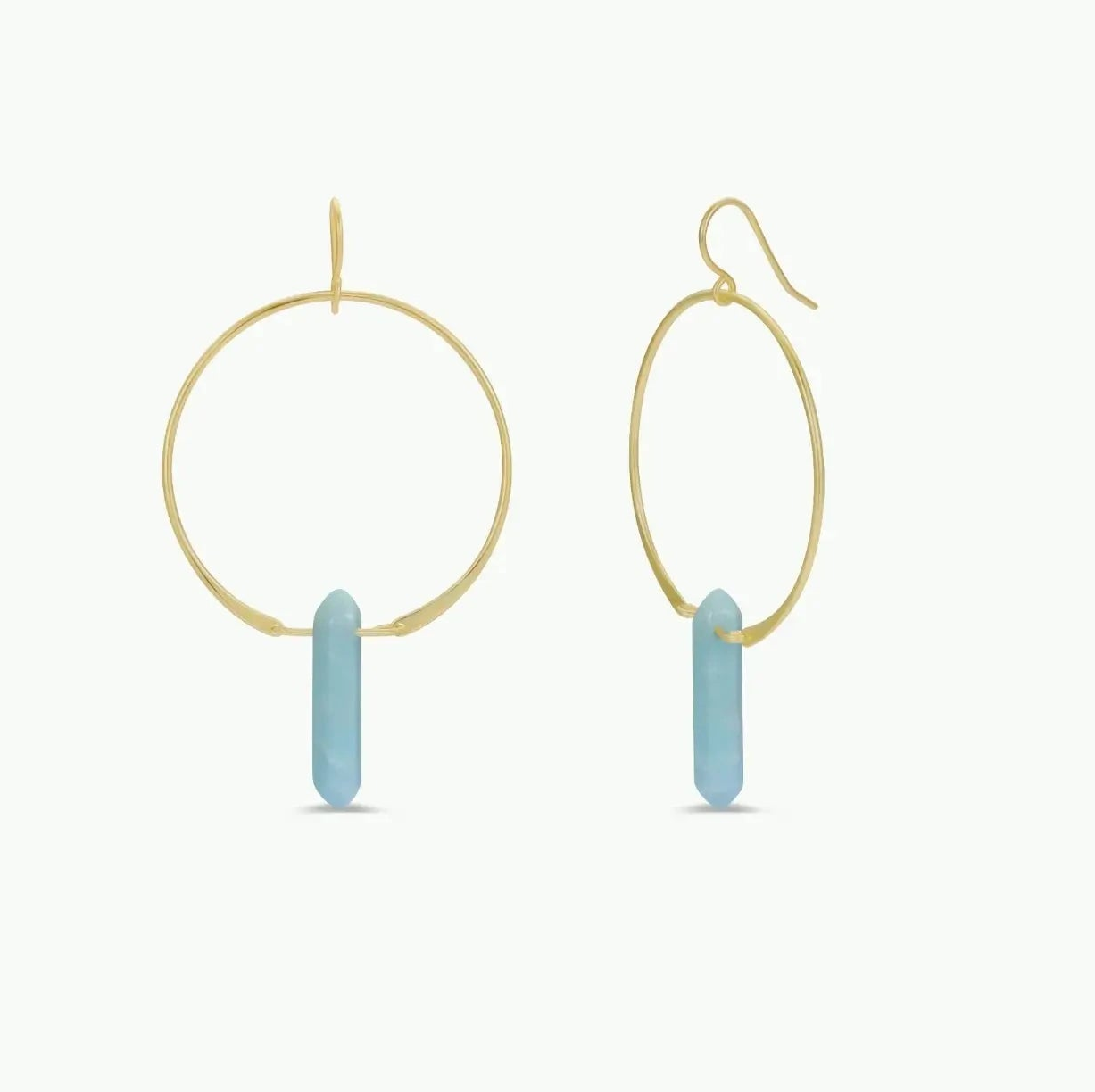 Gold hoop earrings with blue Amazonite cylindrical gemstones on a white background