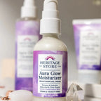 Heritage Store Aura Glow Moisturizer for Face with Bakuchiol and Clear Quartz, 1.9 fl oz bottle on display.