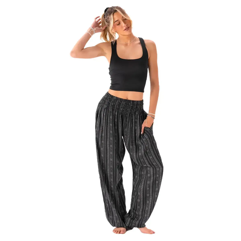 Flowy Striped Black Boho Harem Pants with Pockets from Lotus and Luna, ideal for yoga, lounging, or casual wear.