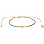 Lotus and Luna Make Waves Goddess Bracelet with white pearl in center surrounded by blue, green and gold crystal beads