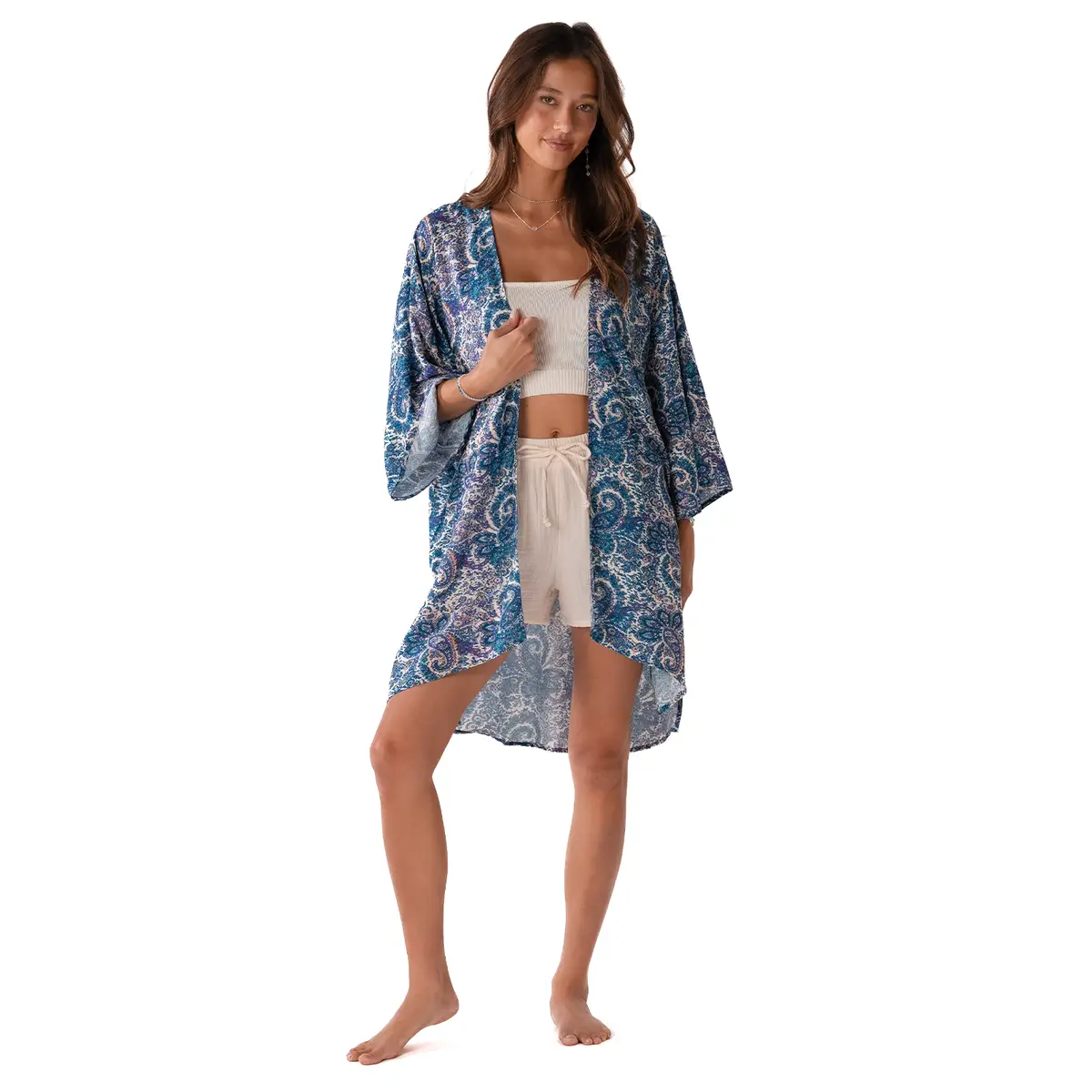 Lotus and Luna Beach Cover in blue paisley print, lightweight handmade swim wrap with side slits, styled as a boho kimono over beachwear.