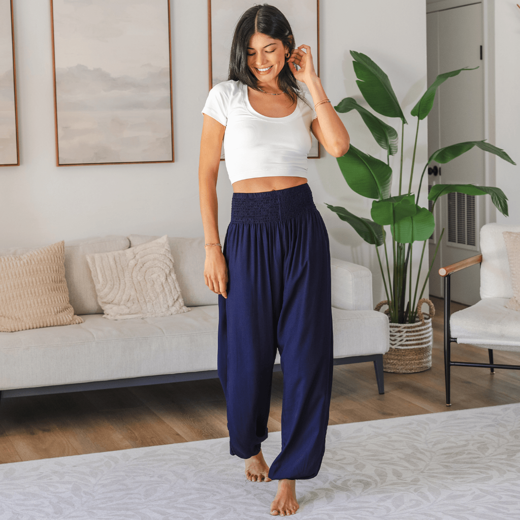Woman wearing Lotus and Luna Harem Pants XL in a cozy living room, showcasing soft fabric and relaxed fit for everyday comfort.