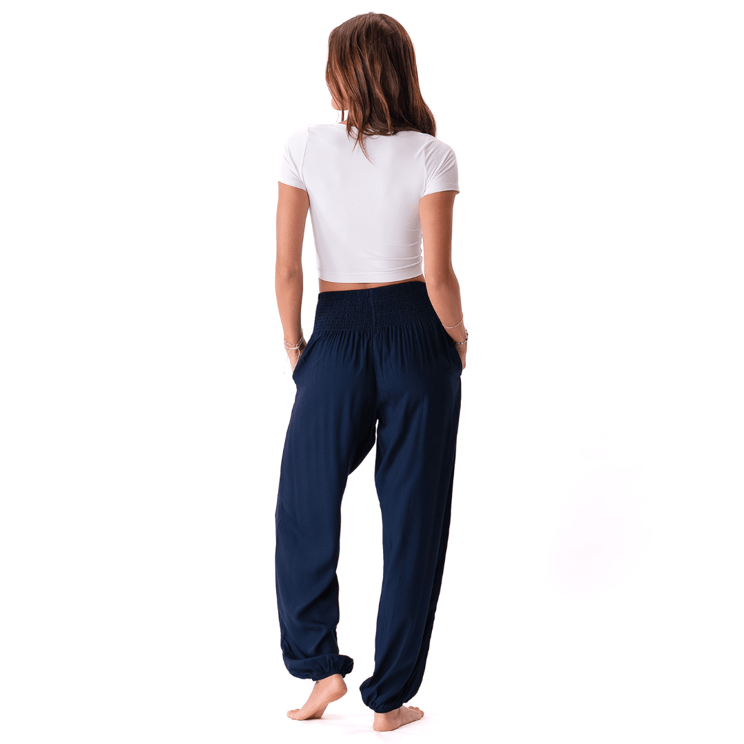 Back view of Lotus and Luna Harem Pants XL in navy, showing relaxed fit and elastic cuffed bottoms for casual comfort.