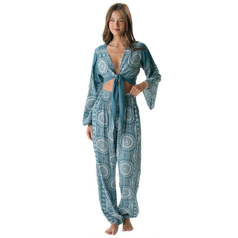 Woman wearing a blue patterned flare sleeve top