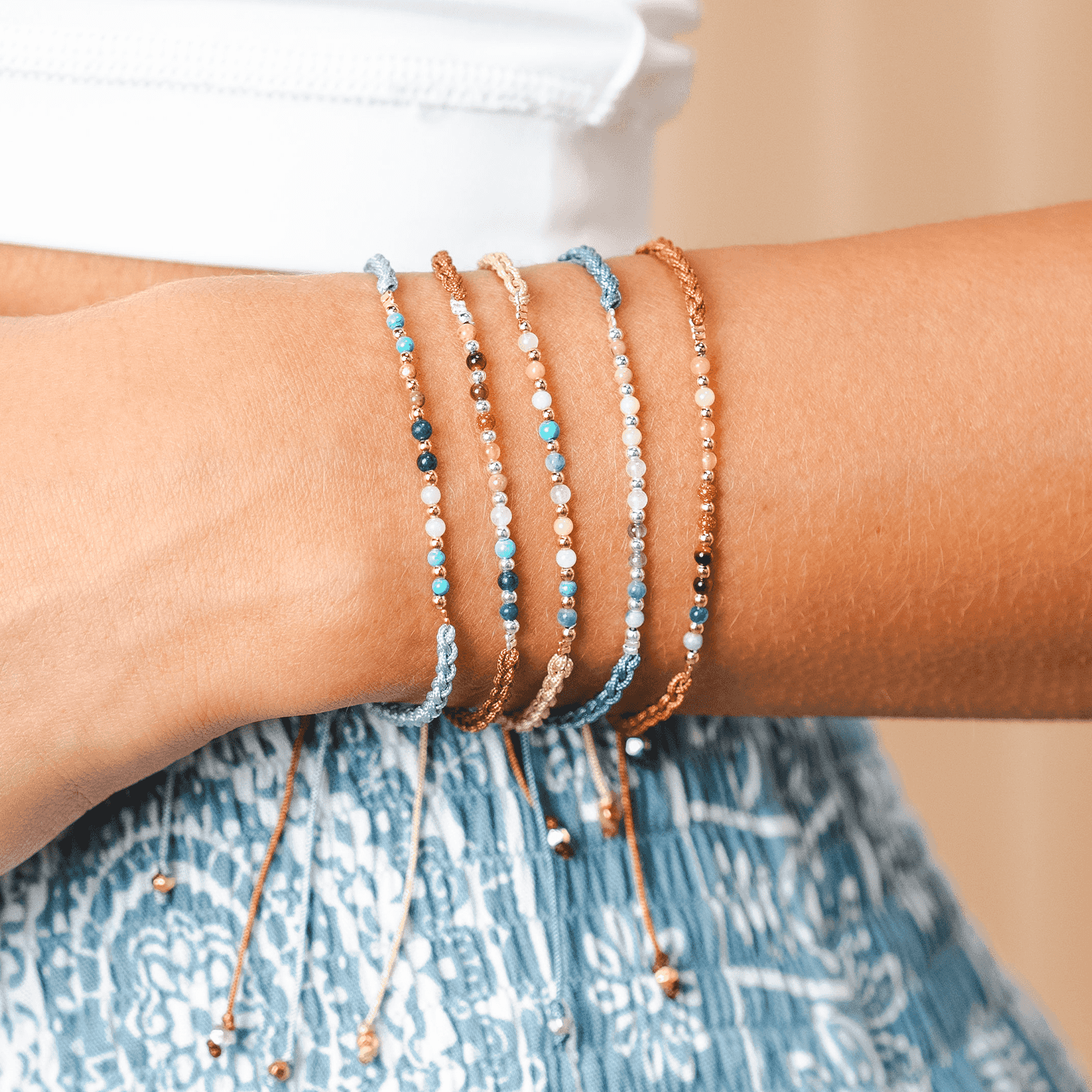 Master Healer Namaste Bracelet Next to Other Lotus and Luna Bracelets