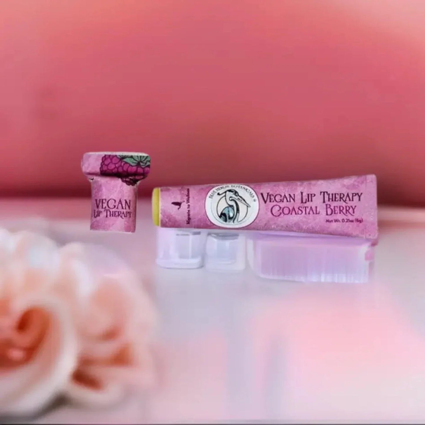 a tube of blue heron botanicals vegan lip balm in coastal berry