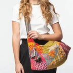 Sevya Handmade Kantha Patchwork Hobo Crossbody Bag shown on model.