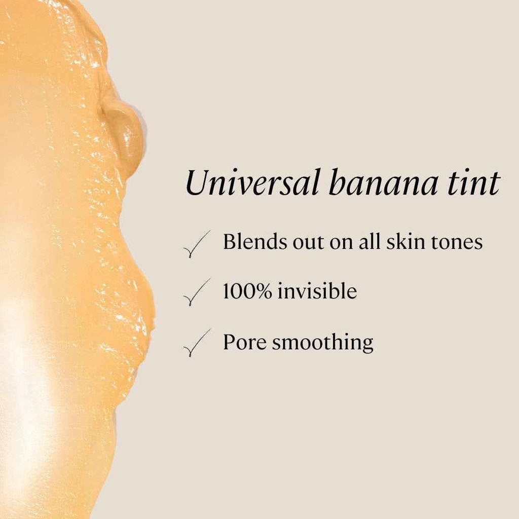Smoothing Face Primer with SPF 30 in universal banana tint, shown with creamy texture; blends on all skin tones and smooths pores.