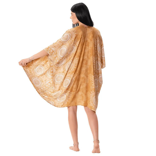 Lotus and Luna kimono beach cover-up, with a white mandala print on honey amber gold fabric, with short sleeves, mid length.