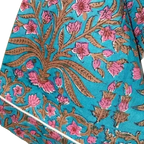 Blue Floral patterned fabric with pink flowers and brown leaves on a blue background