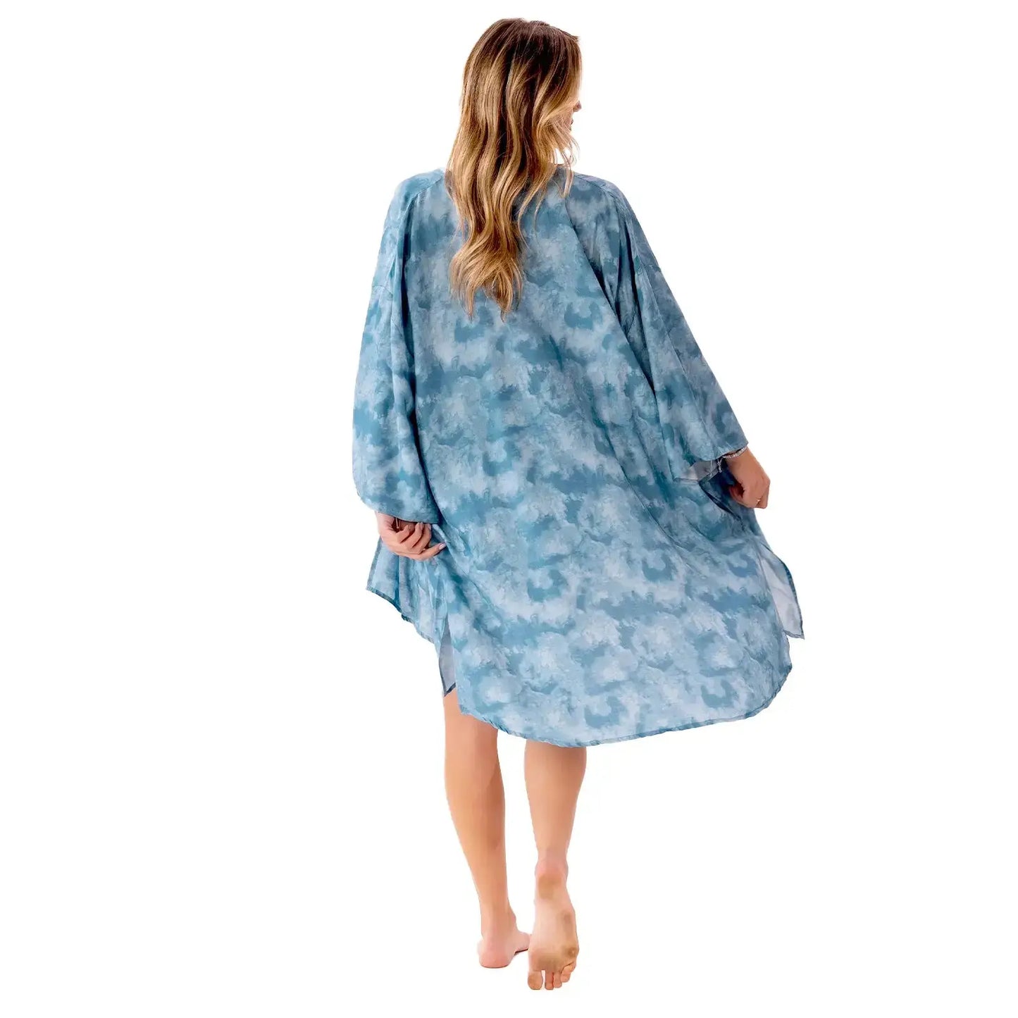 a woman in a blue swim cover up