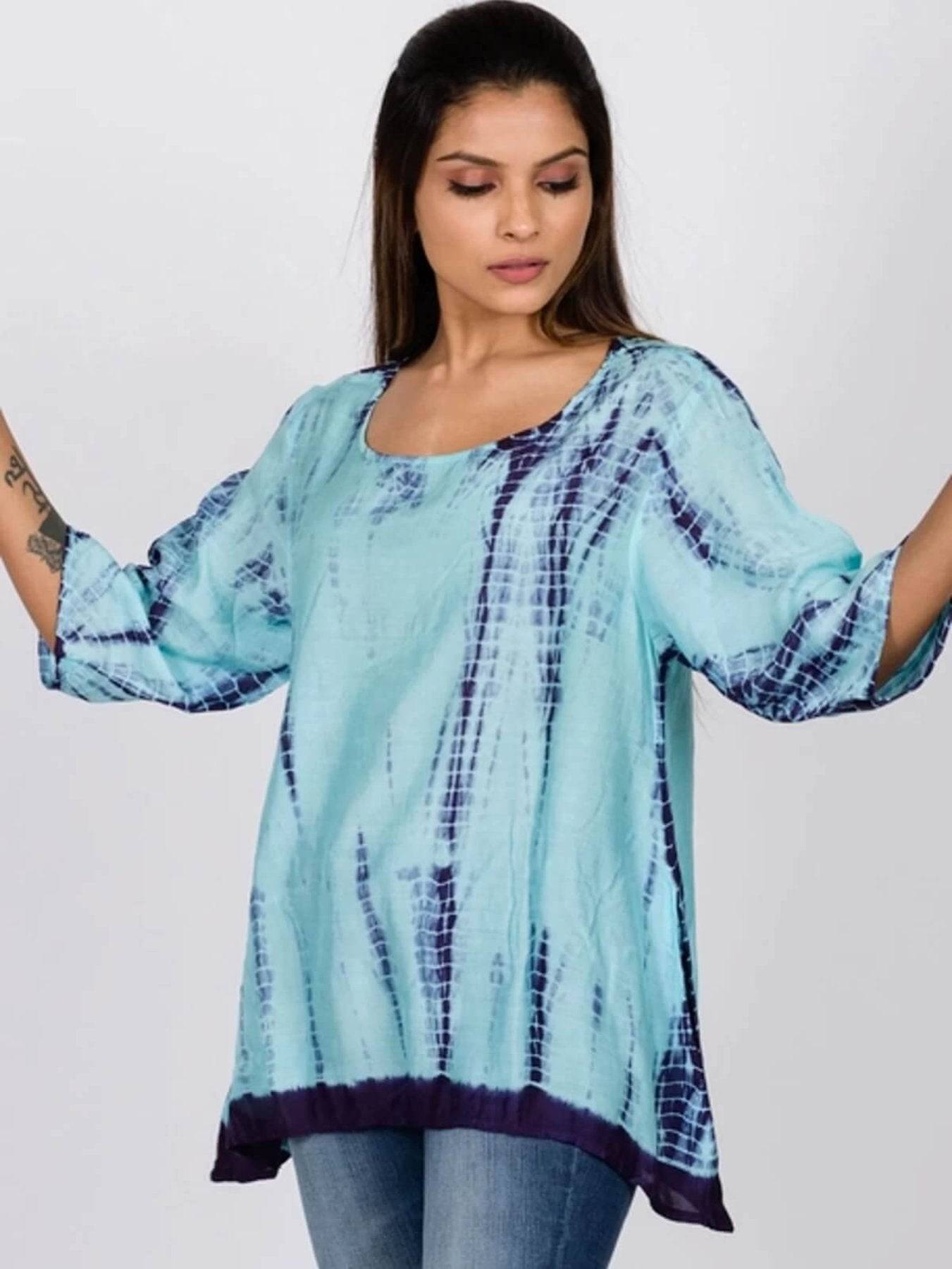 woman wearing blue tie dye tunic top from sevya