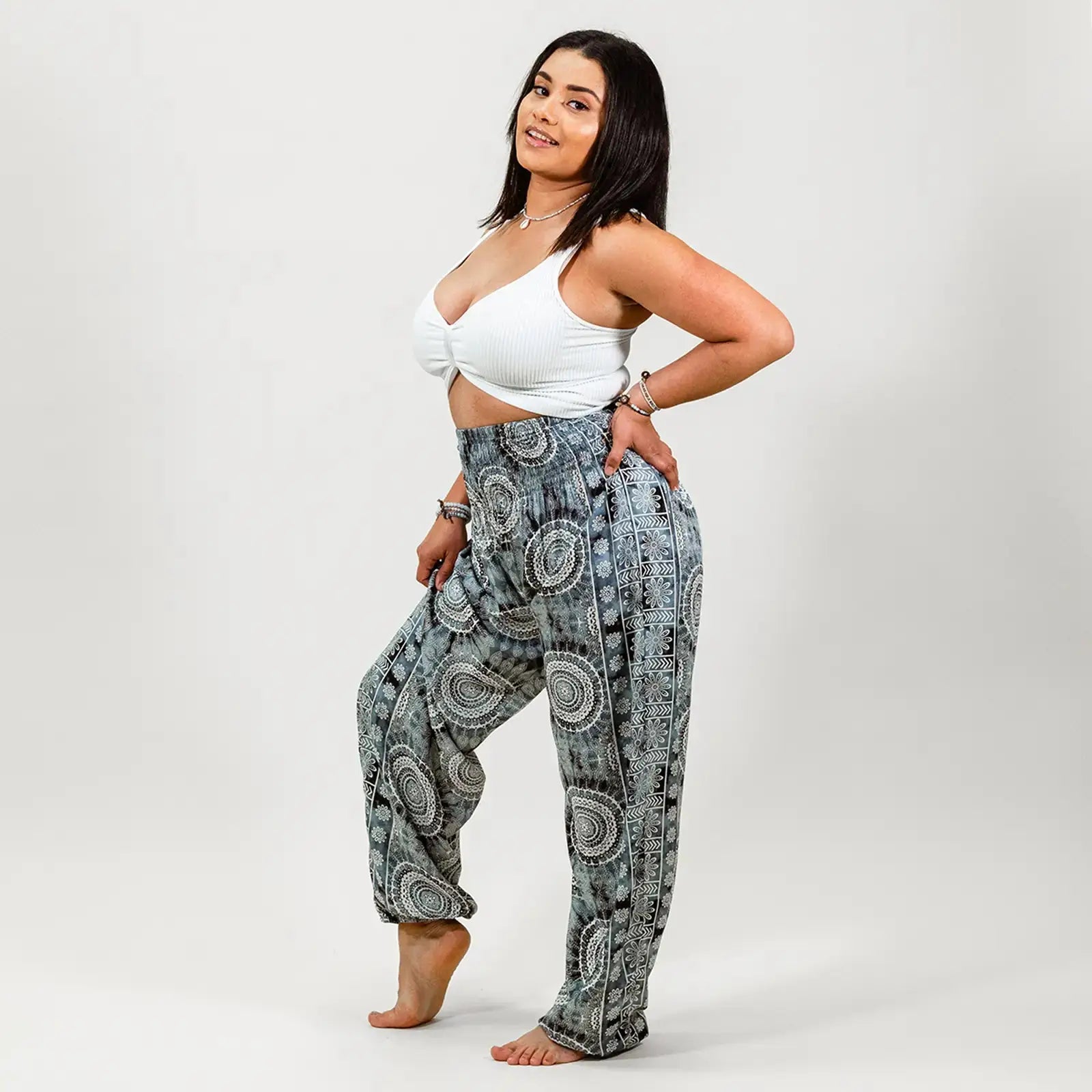 woman wearing blue boho harem pants from lotus and luna brand