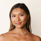Boho Flower Earrings Dangle Style in 14k Yellow Gold with white Crystals worn by model.