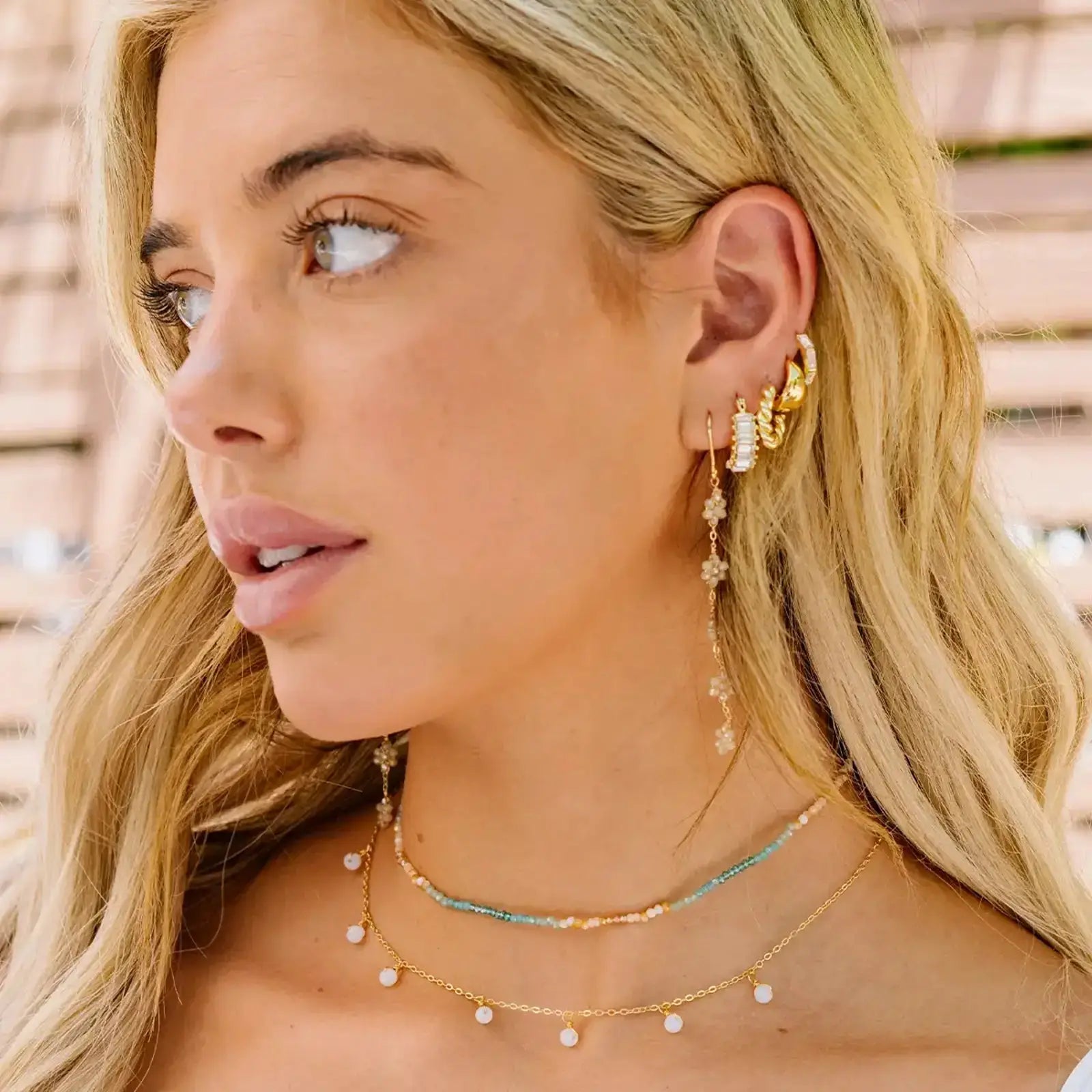 boho flower dangle earrings by lotus and luna on model