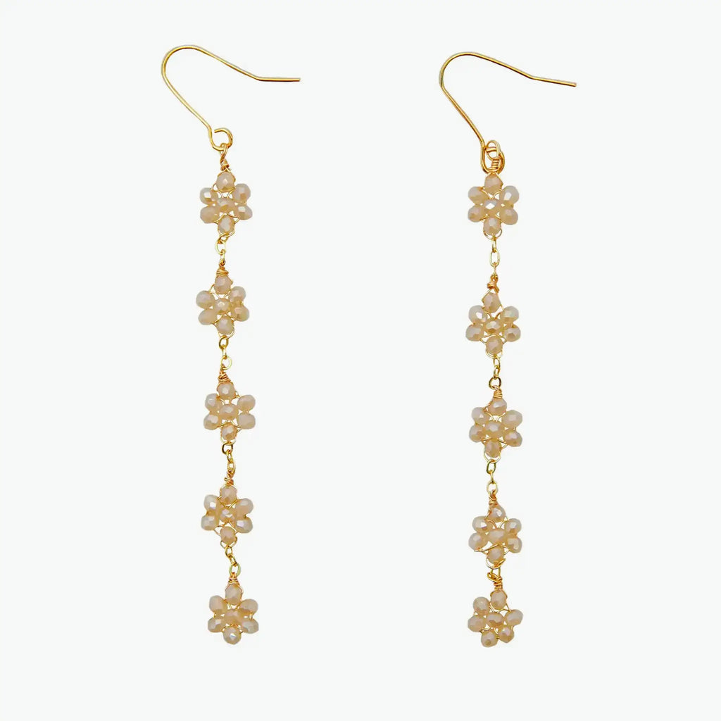 Boho flower earrings in 14k yellow gold with crystal accents, featuring five delicate floral drops for a chic, festival-ready dangle style.