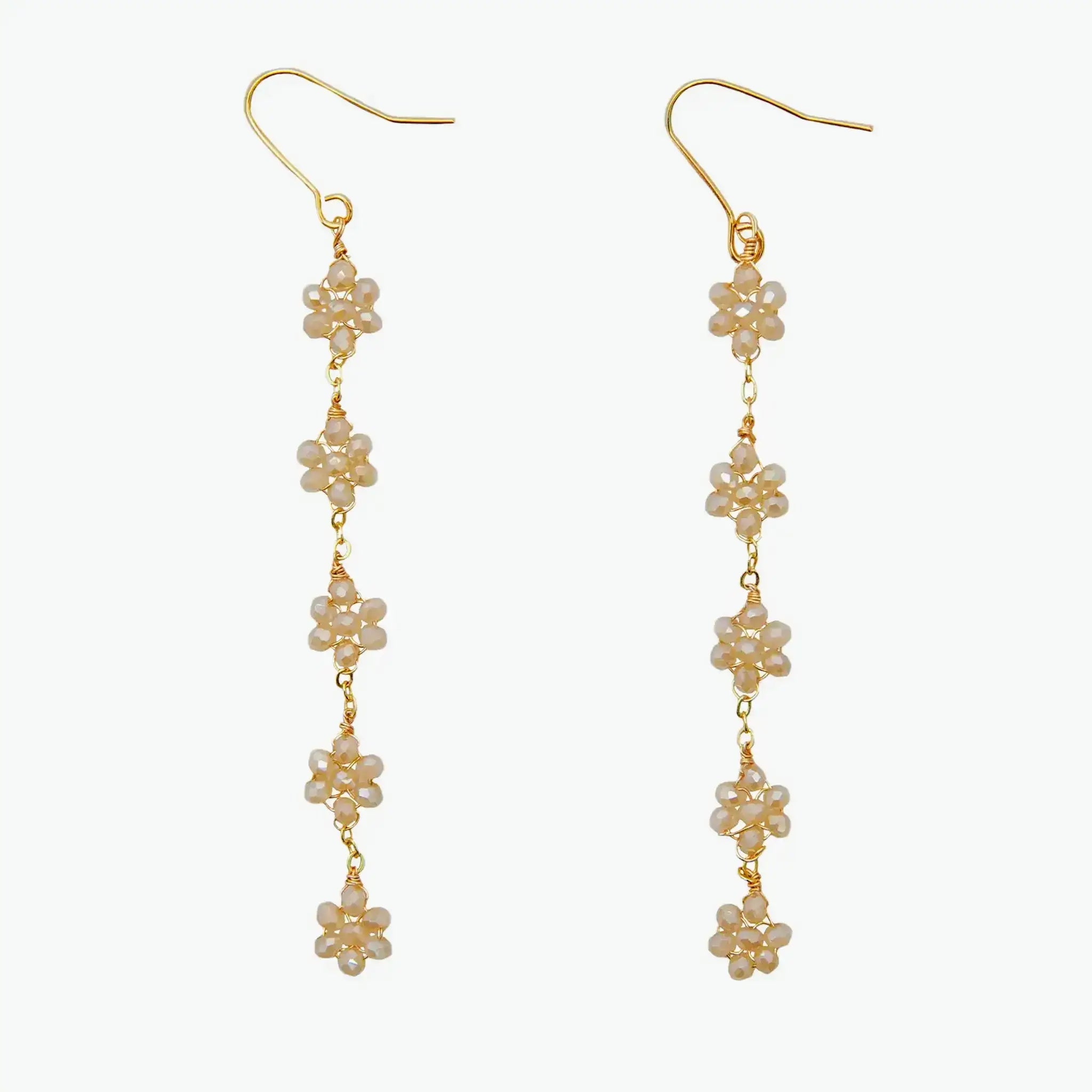 Boho flower earrings in 14k yellow gold with crystal accents, featuring five delicate floral drops for a chic, festival-ready dangle style.