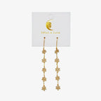 boho flower dangle earrings by lotus and luna, elegant floral design perfect for boho fashion.