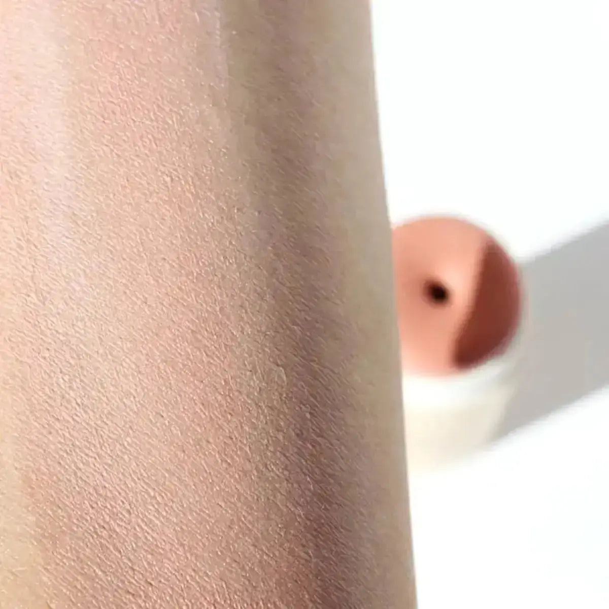 Pink Colored Cream Blush Stick applied to skin - River Organics