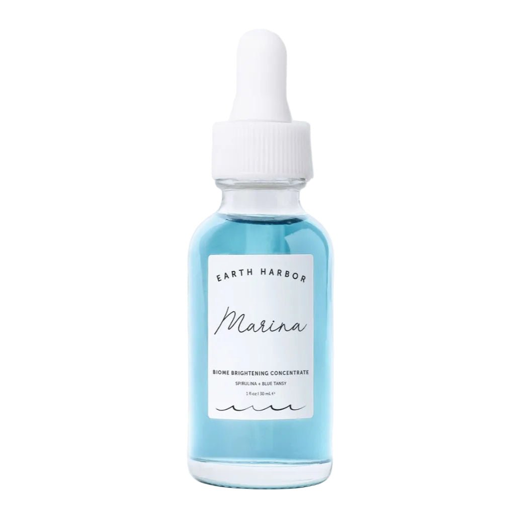 EARTH HARBOR Marina Biome Brightening Concentrate, a light blue colored face serum in 1 oz clear glass dropper bottle.