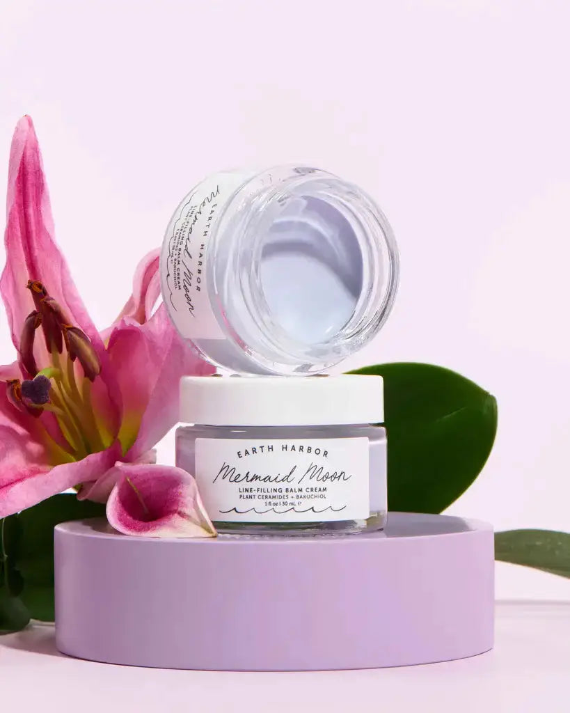 Earth Harbor Mermaid Moon Line Filling Night Cream in an open jar, showcasing its smooth texture. A hydrating anti-aging cream for youthful skin.