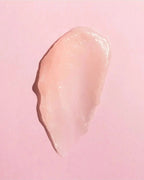Close-up of Earth Harbor SEA KISS plumping lip balm swatch, showcasing its smooth, glossy texture and sheer pink tint.