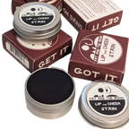 Fat and the Moon Lip and Cheek Stain in reusable aluminum tin shown next to its box - Photo by Elle and Willow