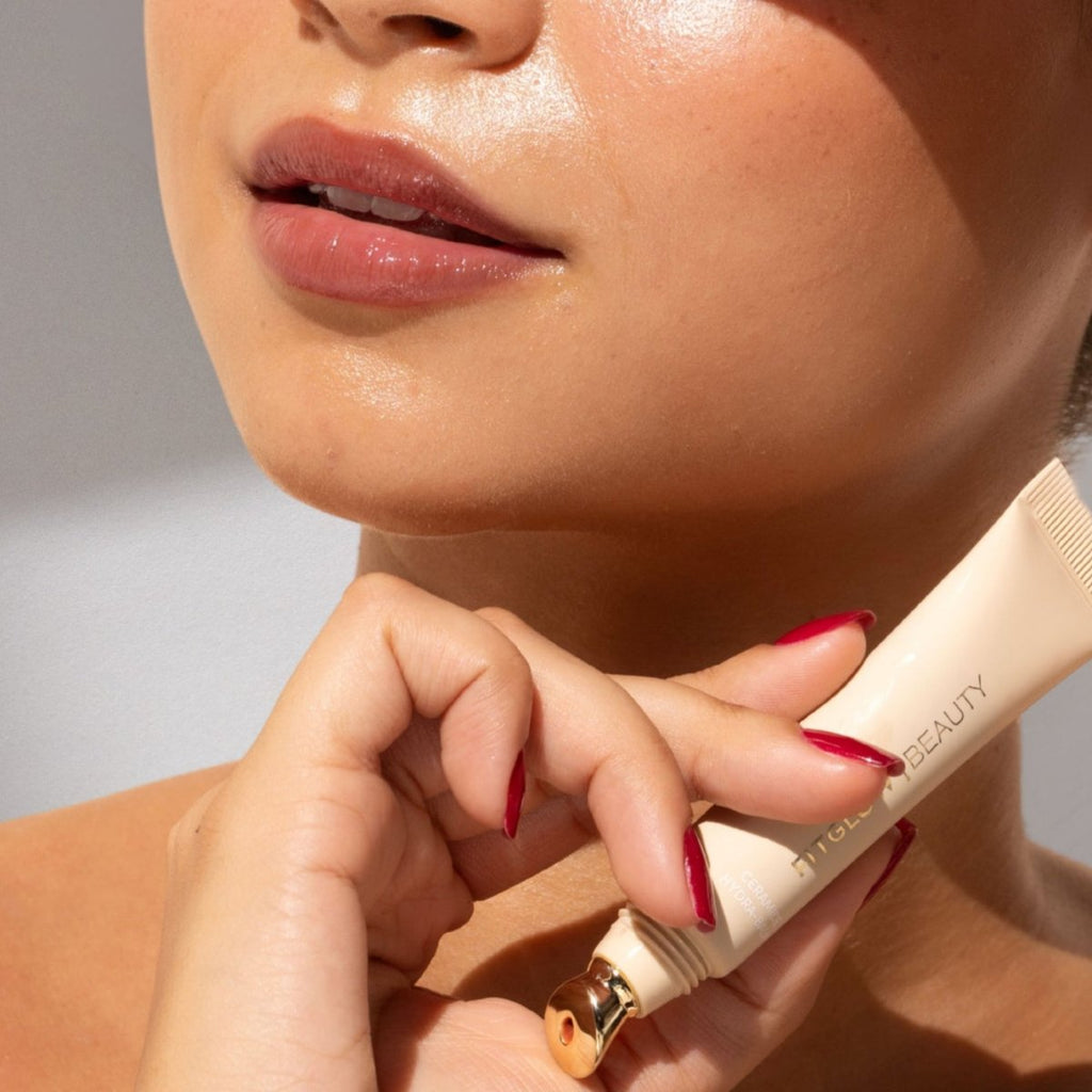 Ceramide hydra balm by Fitglow Beauty in Rosewood applied to lips, showing the medium coverage and berry rose pink color