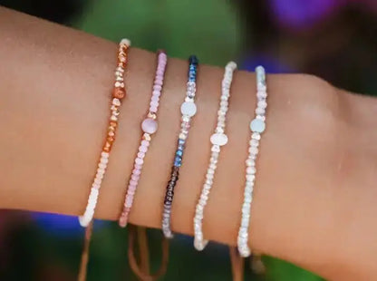 Lotus-and-Luna gemstone and crystal goddess bracelets on modeled wrist